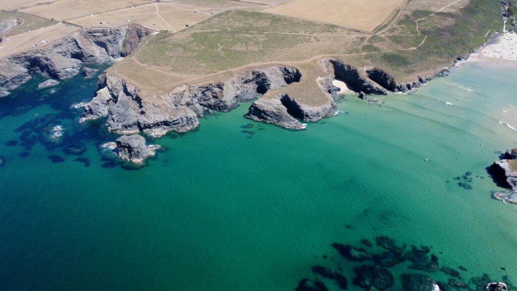 Aerial drone photo of a rugged coastline and turquoise sea