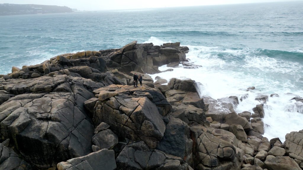 Aerial drone photo of rocks along a rocky shoreline